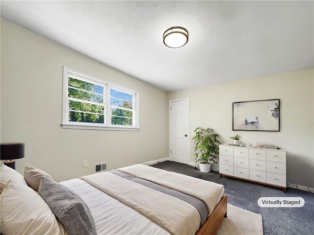 3811 Reynolds Rd, Douglasville, GA 30135 - bedroom featuring dark colored carpet, baseboards, and visible vents