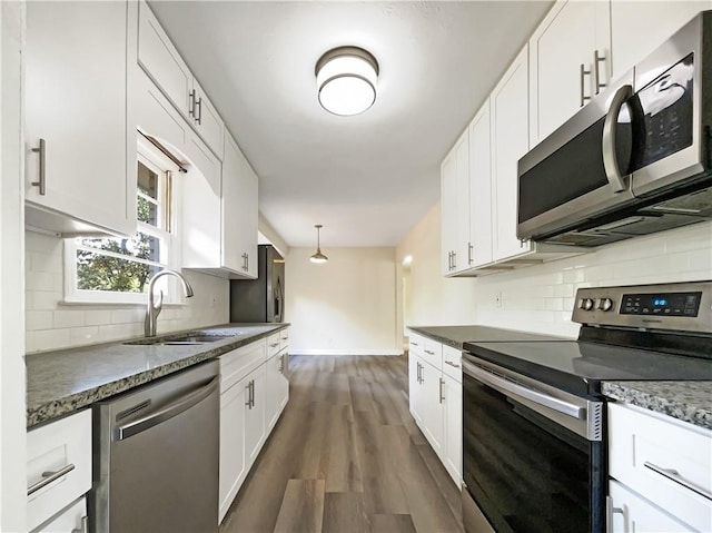 3811 Reynolds Rd, Douglasville, GA 30135 - kitchen featuring backsplash, dark wood finished floors, appliances with stainless steel finishes, and a sink