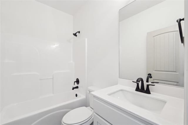 bathroom featuring vanity, toilet, and tub / shower combination