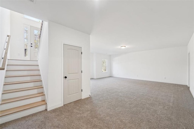 interior space featuring carpet and stairs