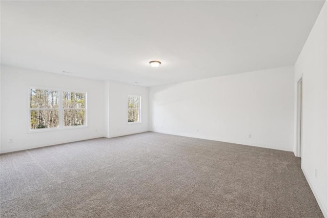 spare room featuring carpet floors