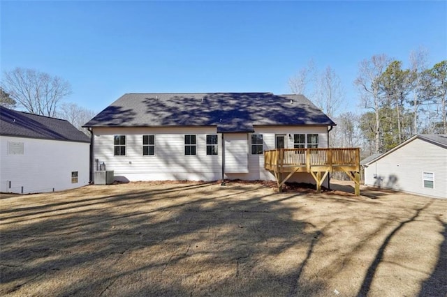 back of property featuring a wooden deck and cooling unit