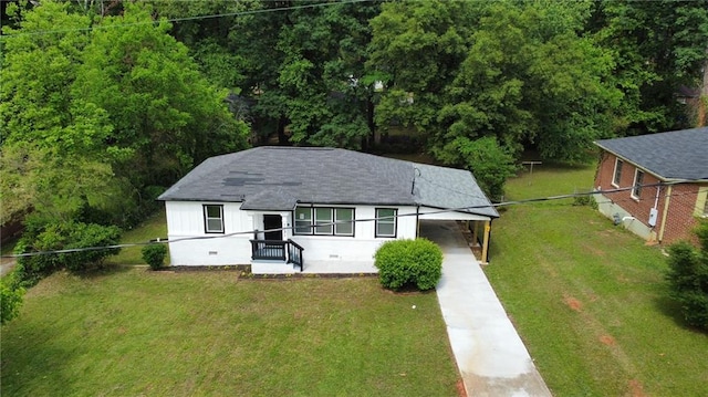 1931 Selwyn Dr, Decatur, GA 30035 - view of front of property with concrete driveway, an attached carport, and roof with shingles