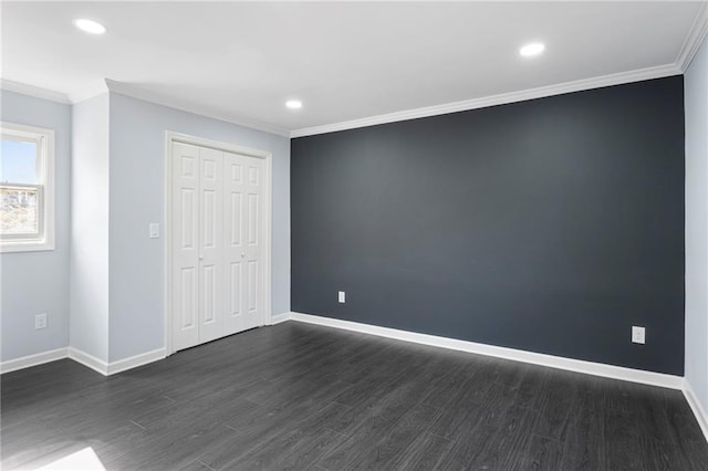 1931 Selwyn Dr, Decatur, GA 30035 - unfurnished bedroom featuring ornamental molding, dark wood-style flooring, baseboards, recessed lighting, and a closet