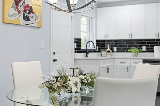1931 Selwyn Dr, Decatur, GA 30035 - kitchen with a chandelier, dishwasher, and white cabinets