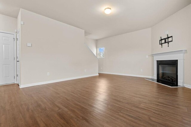 unfurnished living room with hardwood / wood-style floors