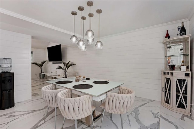 dining space with light tile patterned flooring and ornamental molding