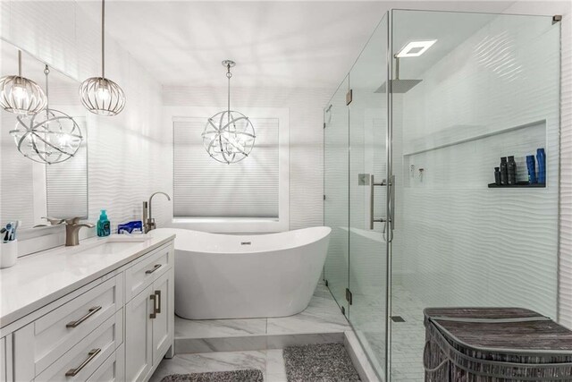 bathroom featuring tile patterned floors, vanity, and separate shower and tub