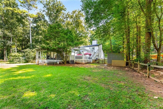 back of house with a pergola and a yard