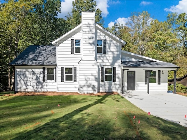 rear view of house with a yard