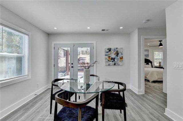 dining space featuring light wood-style floors, baseboards, visible vents, and recessed lighting