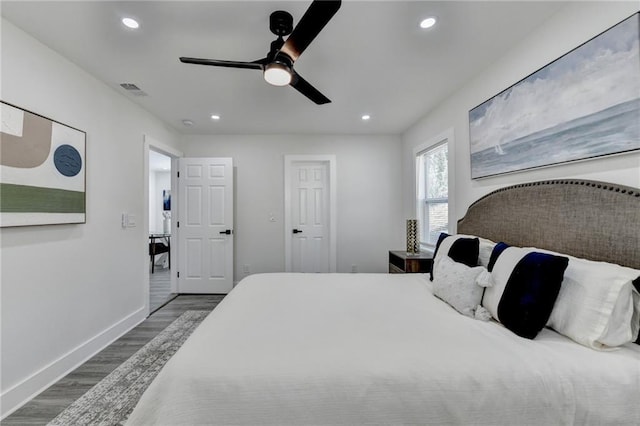 bedroom featuring recessed lighting, wood finished floors, visible vents, a ceiling fan, and baseboards