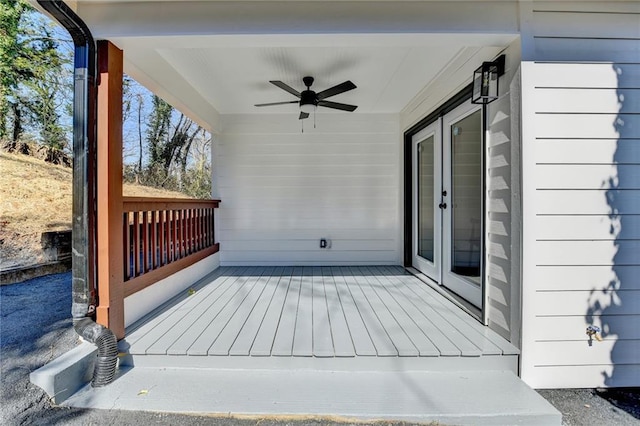 wooden terrace featuring ceiling fan