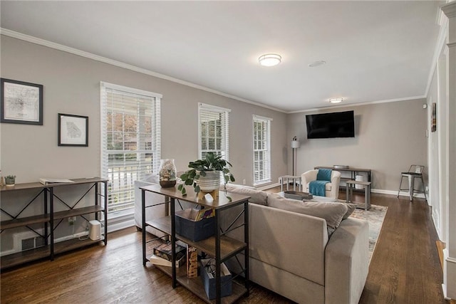 living room with dark wood-type flooring and ornamental molding