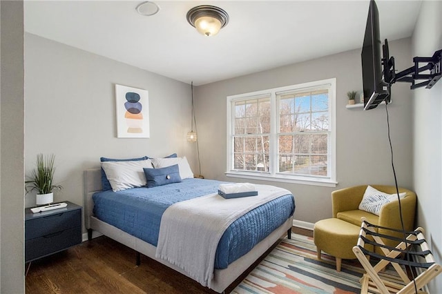 bedroom featuring dark hardwood / wood-style flooring