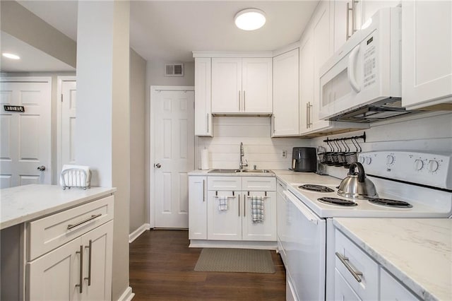 kitchen featuring white cabinetry, sink, dark wood-type flooring, light stone counters, and white appliances