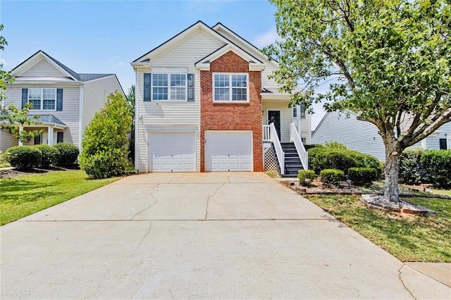 1910 Towne Park Dr, Mcdonough, GA 30252 - view of front facade featuring an attached garage, brick siding, driveway, stairway, and a front yard