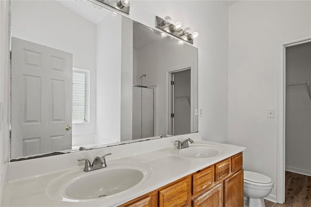 1910 Towne Park Dr, Mcdonough, GA 30252 - full bathroom with a stall shower, a spacious closet, double vanity, toilet, and a bath