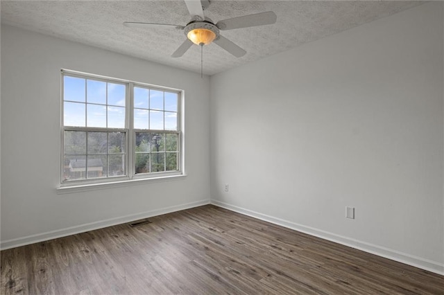 1910 Towne Park Dr, Mcdonough, GA 30252 - empty room featuring dark wood-style floors, a textured ceiling, and baseboards