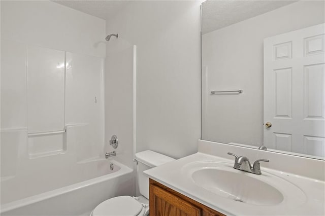 1910 Towne Park Dr, Mcdonough, GA 30252 - bathroom with a textured ceiling, toilet, vanity, and  shower combination