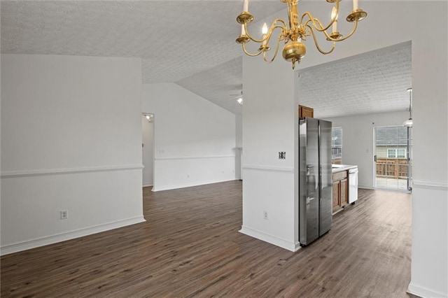 1910 Towne Park Dr, Mcdonough, GA 30252 - kitchen featuring stainless steel refrigerator with ice dispenser, dark wood-style flooring, a textured ceiling, a chandelier, and open floor plan