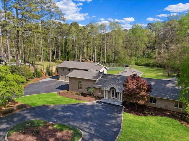 860 Crest Valley Dr, Sandy Springs, GA 30327 - view of subject property featuring a heavily wooded area
