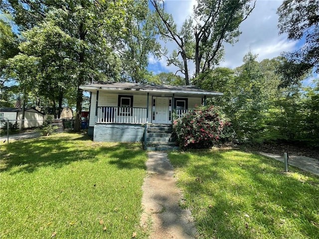 bungalow-style house with covered porch and a front lawn