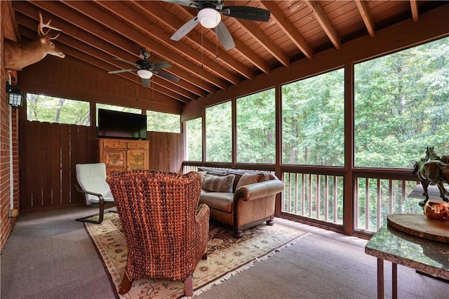 sunroom featuring wood ceiling, vaulted ceiling with beams, and ceiling fan