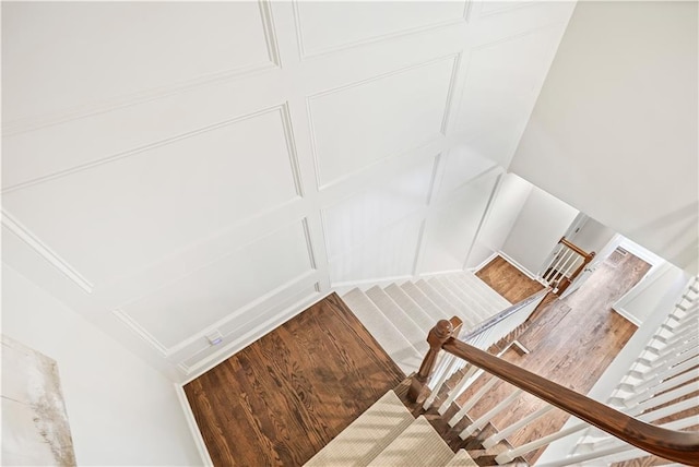 stairs with hardwood / wood-style floors