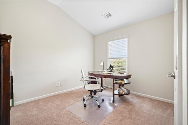 office area with lofted ceiling and light carpet