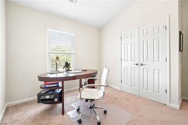 carpeted office space with lofted ceiling