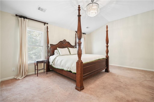 carpeted bedroom featuring lofted ceiling and a chandelier