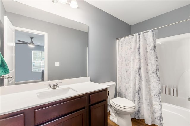244 Grand Central Way, Cartersville, GA 30120 - bathroom with vanity, toilet, wood finished floors, ceiling fan, and shower / tub combo with curtain