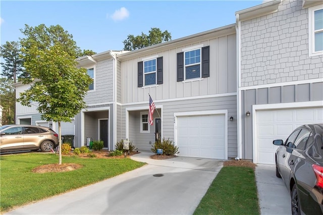 244 Grand Central Way, Cartersville, GA 30120 - view of property with board and batten siding, concrete driveway, an attached garage, and a front lawn