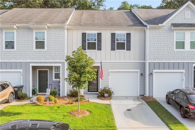 244 Grand Central Way, Cartersville, GA 30120 - multi unit property with concrete driveway, a garage, and board and batten siding