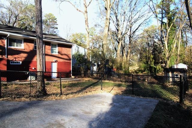 view of yard featuring a fenced front yard and a patio area