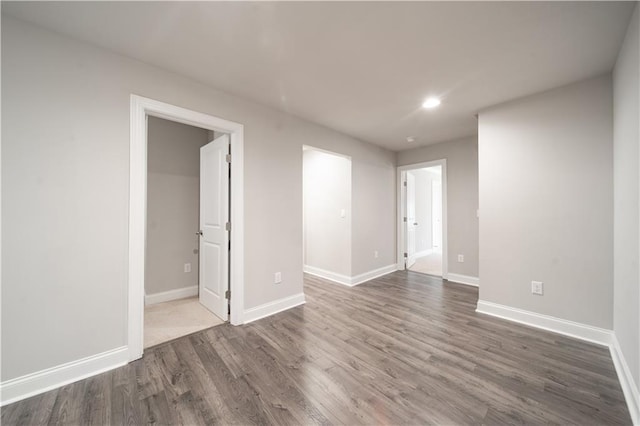 unfurnished room featuring dark wood-type flooring