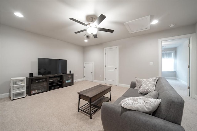 living room featuring light carpet and ceiling fan