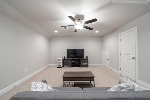 living room with ceiling fan and light colored carpet