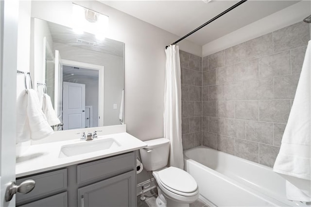 full bathroom with toilet, vanity, and shower / tub combo