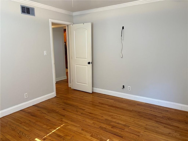 375 6th St NE Unit 5, Atlanta, GA 30308 - unfurnished room with baseboards, crown molding, and wood finished floors