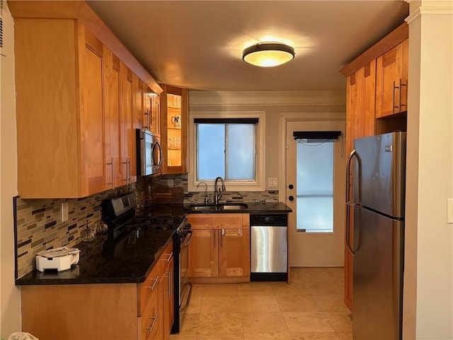 375 6th St NE Unit 5, Atlanta, GA 30308 - kitchen with stainless steel appliances, a sink, tasteful backsplash, and brown cabinets