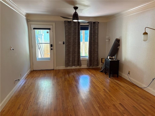 375 6th St NE Unit 5, Atlanta, GA 30308 - spare room with healthy amount of natural light, wood finished floors, crown molding, a ceiling fan, and baseboards