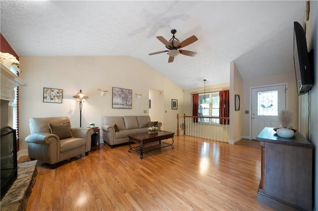 2281 Carlan Rd, Jasper, GA 30139 - living room with a ceiling fan, light wood-type flooring, vaulted ceiling, and baseboards