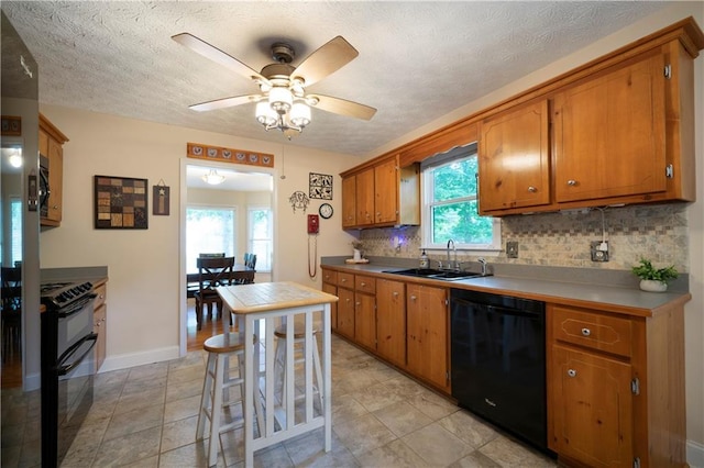 2281 Carlan Rd, Jasper, GA 30139 - kitchen featuring black appliances, a sink, brown cabinetry, tasteful backsplash, and a ceiling fan