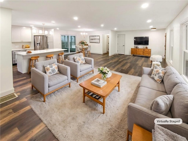 living room with dark hardwood / wood-style flooring