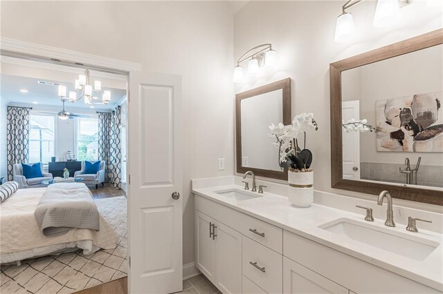 bathroom featuring double vanity and a chandelier