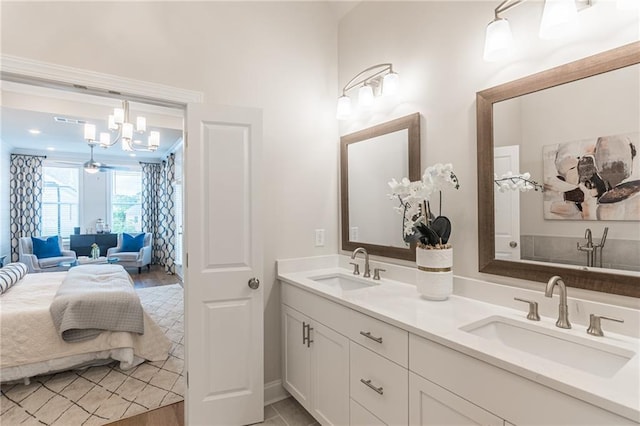 bathroom with vanity and a chandelier