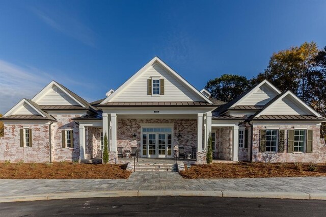 craftsman-style home featuring french doors