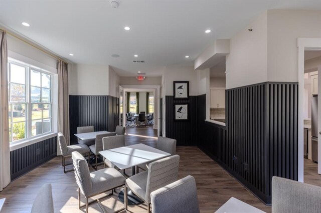 interior space featuring dark wood-type flooring and a healthy amount of sunlight